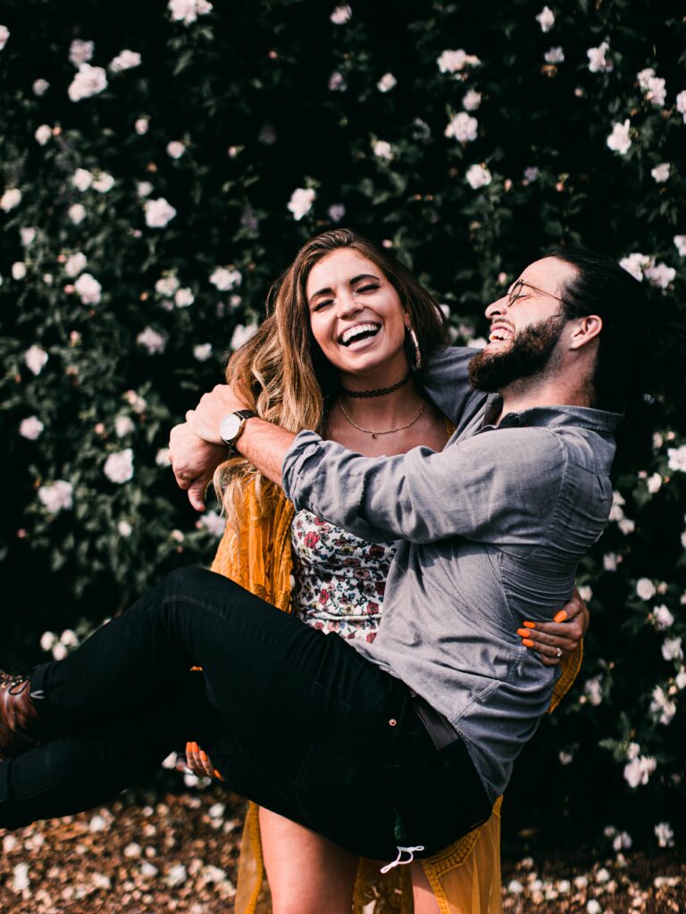 Engagement photos of couple laughing